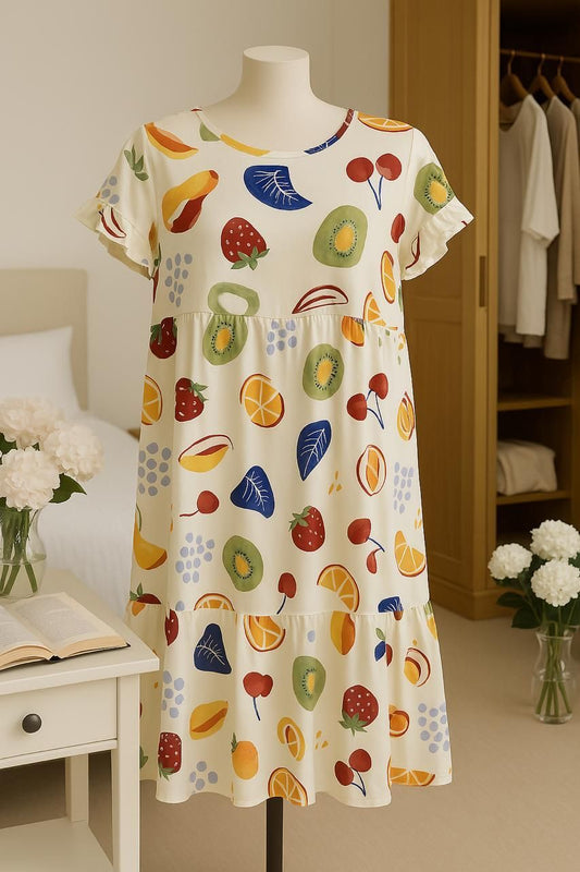 Dress with fruit pattern on a mannequin in a room setting
