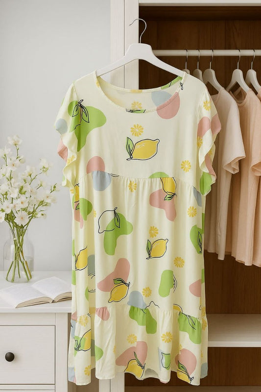 Floral-patterned dress on a hanger with a background of clothes and a vase.