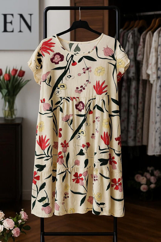 Floral dress on a hanger with a blurred background of clothing and flowers.